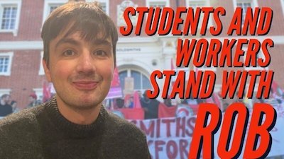 Roberto is pictured from the chest up, wearing a black shirt and smiling, next to red text that reads "Students and Workers Stand With Rob"